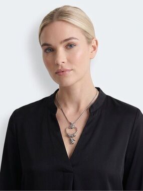 Brighton "Squeeze My Heart" charm holder necklace featuring an angel charm.